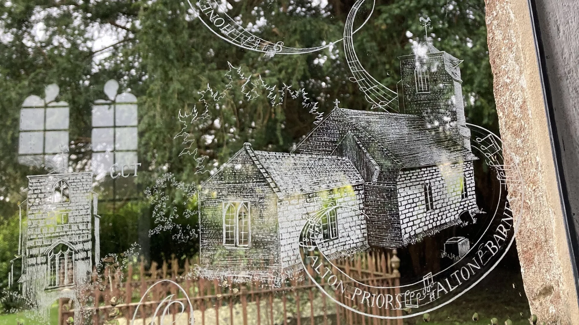 The Music for Awhile engraved glass window engraved by Frank Grenier to a design inspired by Simon Whistler for the chancel of All Saints, Alton Priors. This small pane engraved with a view of the surrounding countryside and music notes in reference to the Music for Awhile festival a very personal piece.

The late Simon Whistler was a volunteer at this church and the co-founder of Music for Awhile, a classical music festival which is still held here annually.