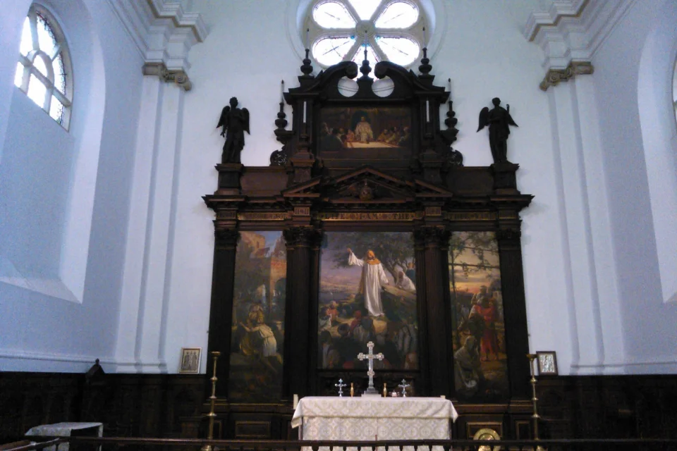 Painted large, ornate wooden altar with images of biblical stories