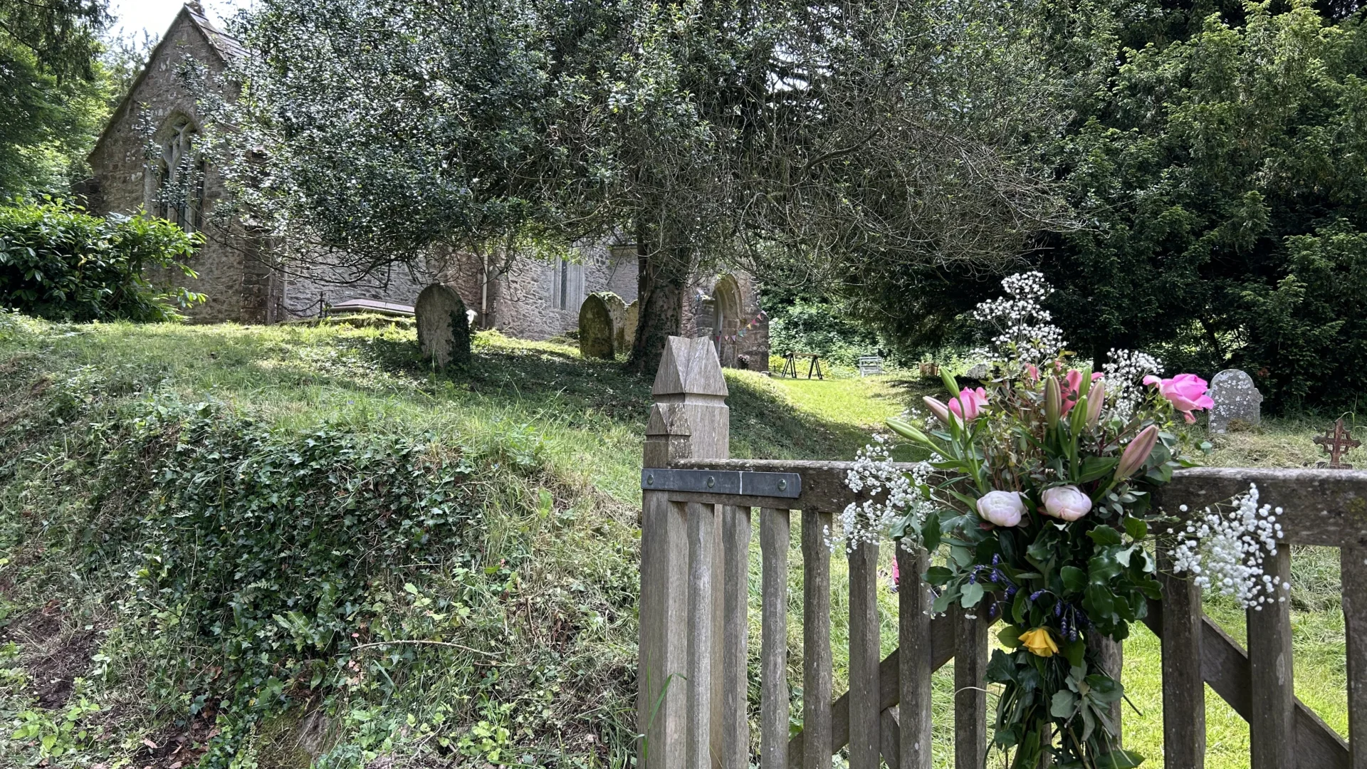 flowers on the entrance gate to Elworthy Church