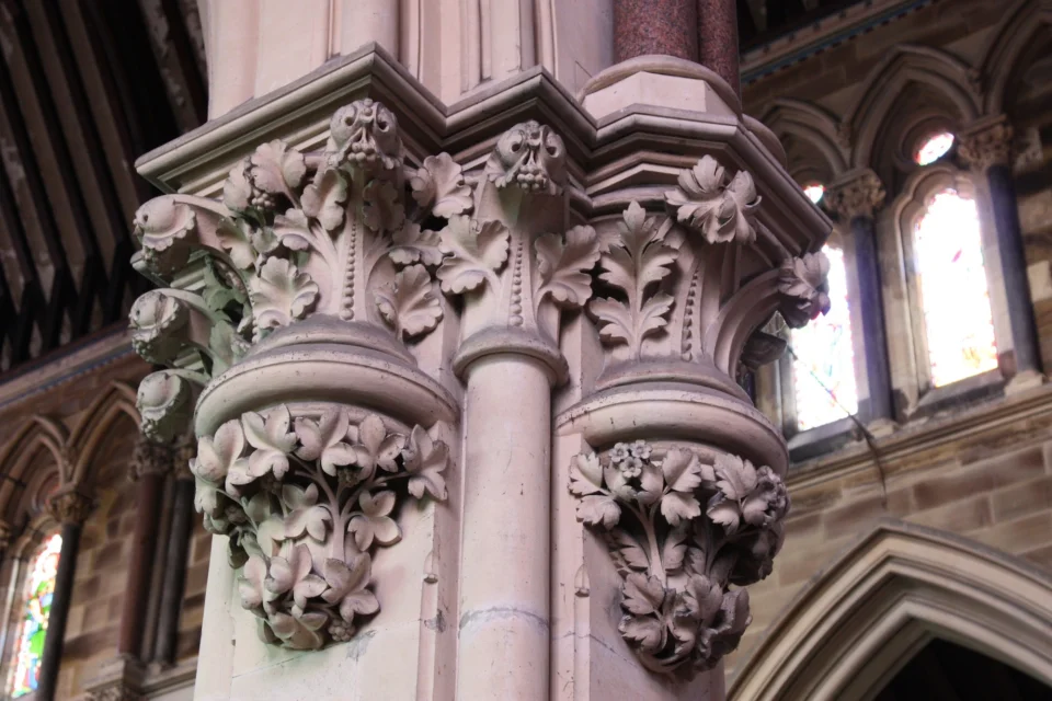 Floral capitals (stone detailing) on column