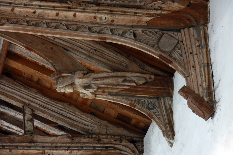 nave roof which is full of carved wooden angels dates from the fifteenth century,