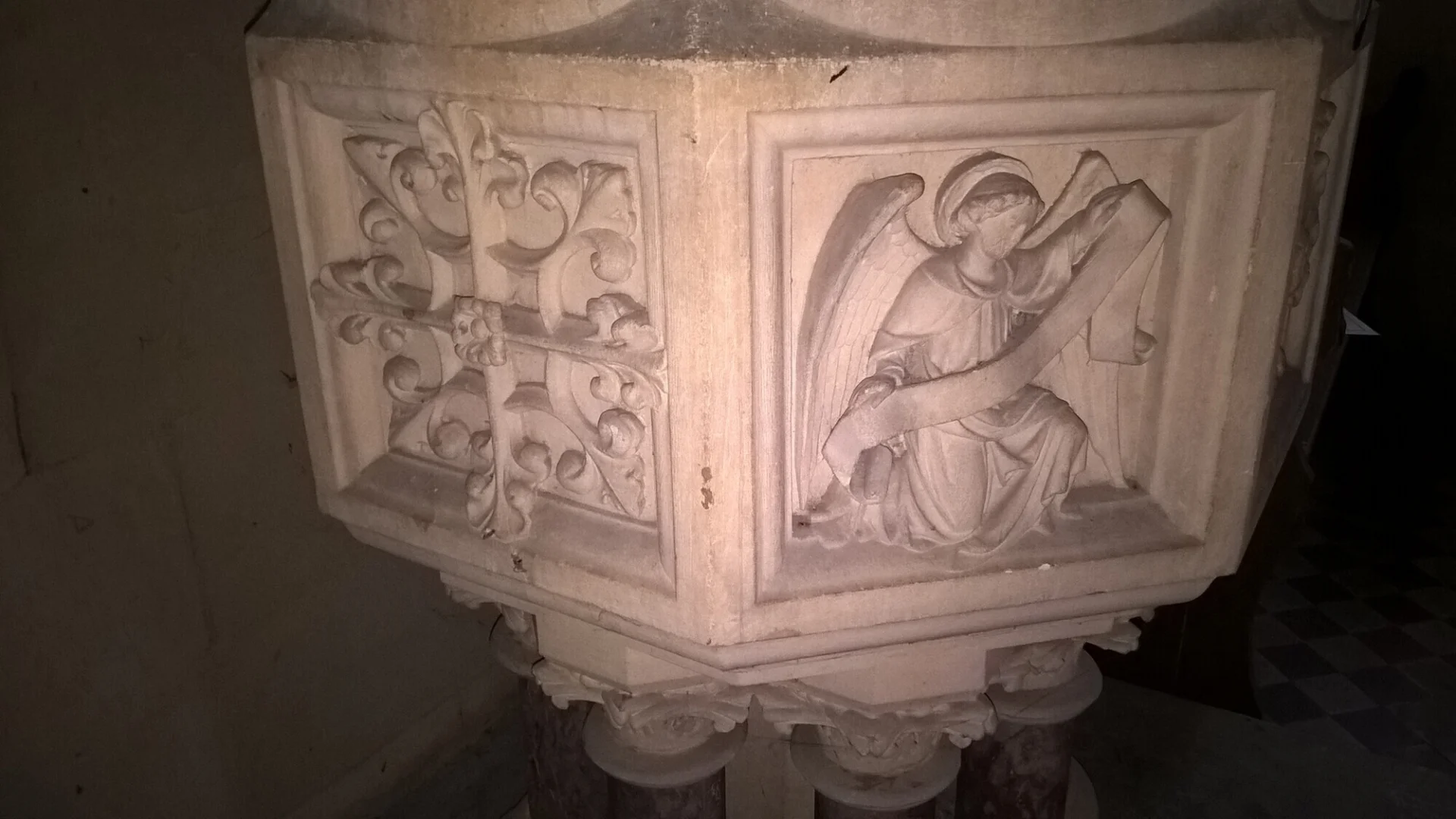 Stone baptismal font exquisitely carved