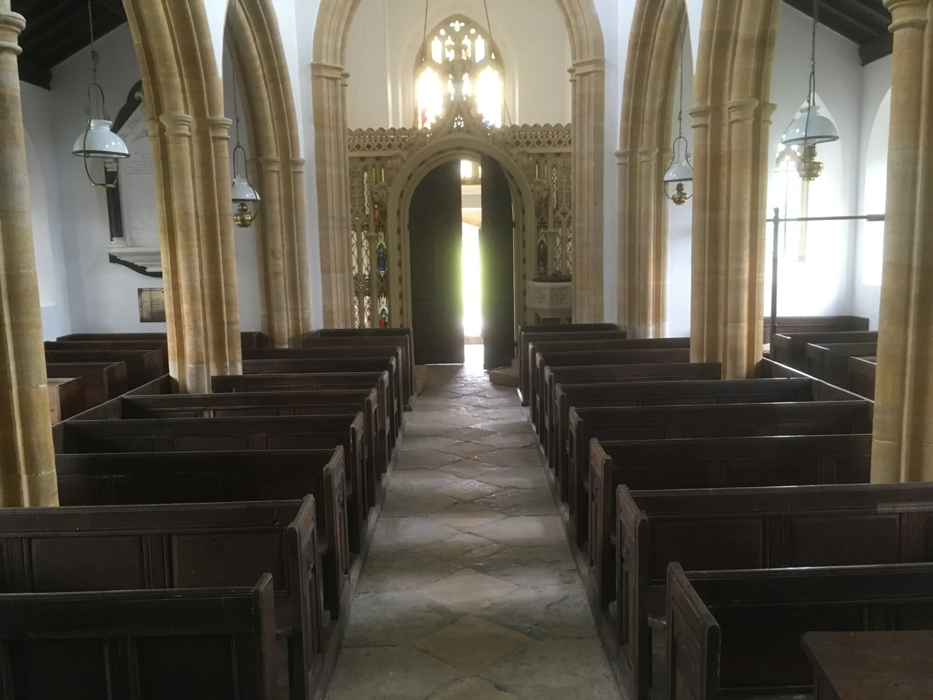 Interior of the church viewed from the central aisle along with stone carved arches