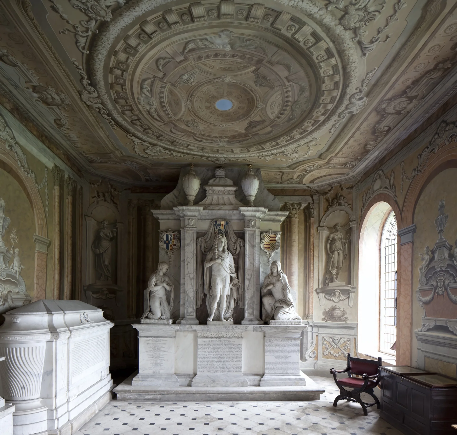 the marble tomb of the 1st Duke of Chandos with three large statues including the Duke at the centre