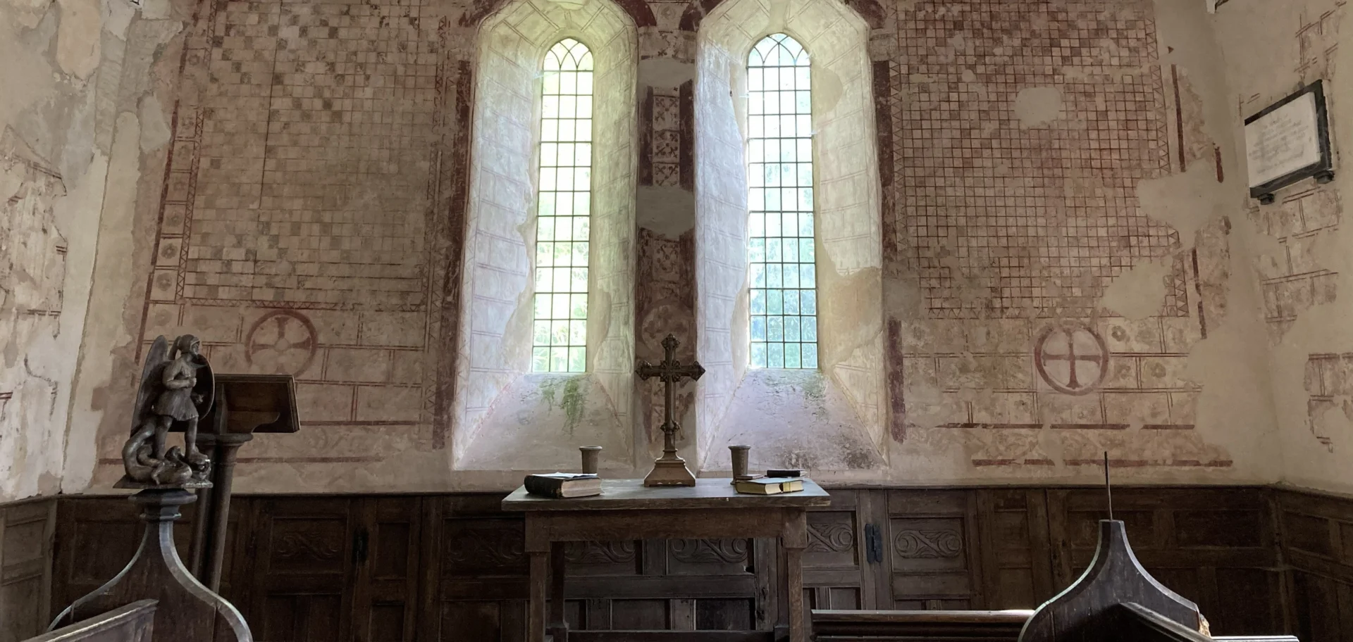 Interior view of windows and wall paintings in St Micheal's Church in Michealchurch.