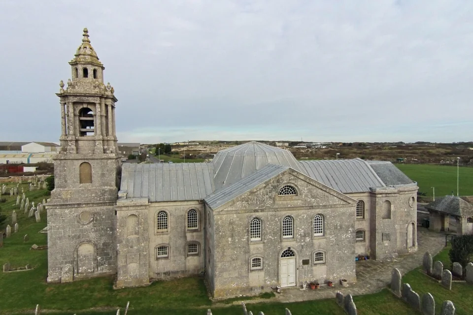 External side view of the church built with light coloured stones