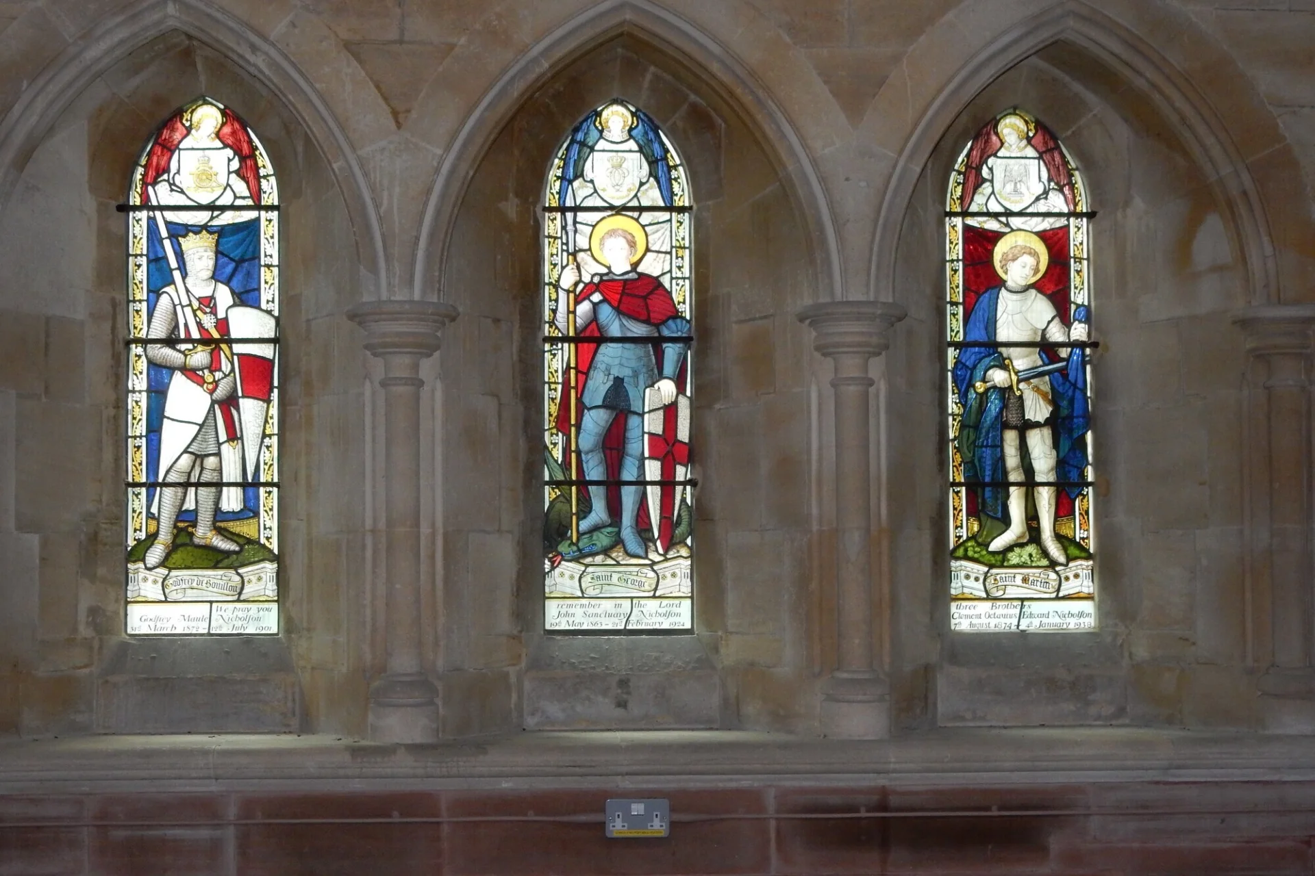 Three impressive stained glass window panels