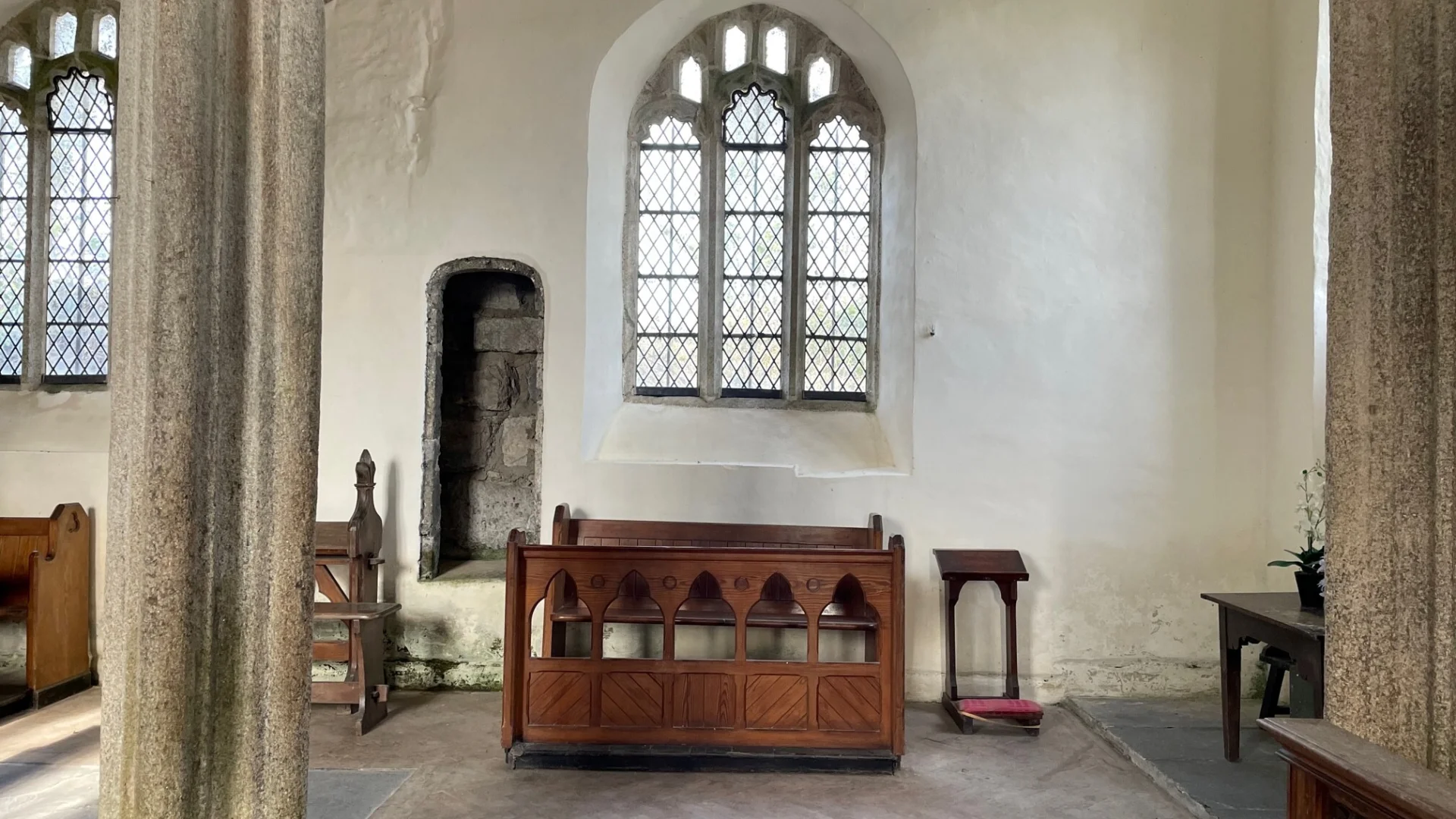 Bradstone North Aisle showing column to left, medieval window to centre