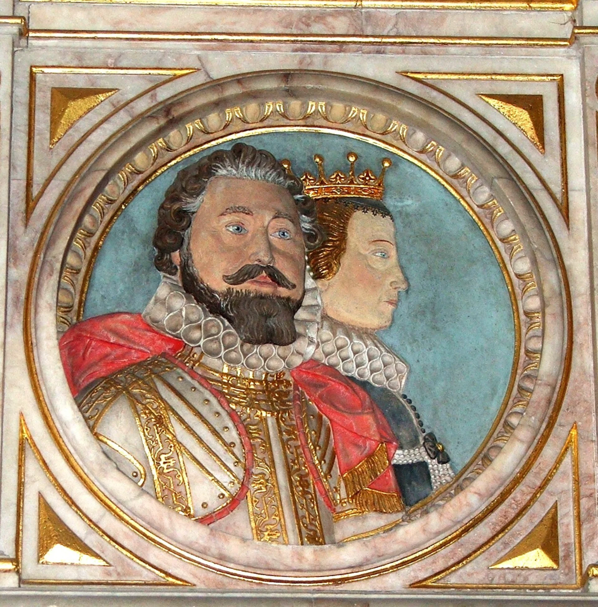 A colourful relief monument showing Frances Wray and her second husband Robert Rich, Earl of Warwick in Jacobean dress.