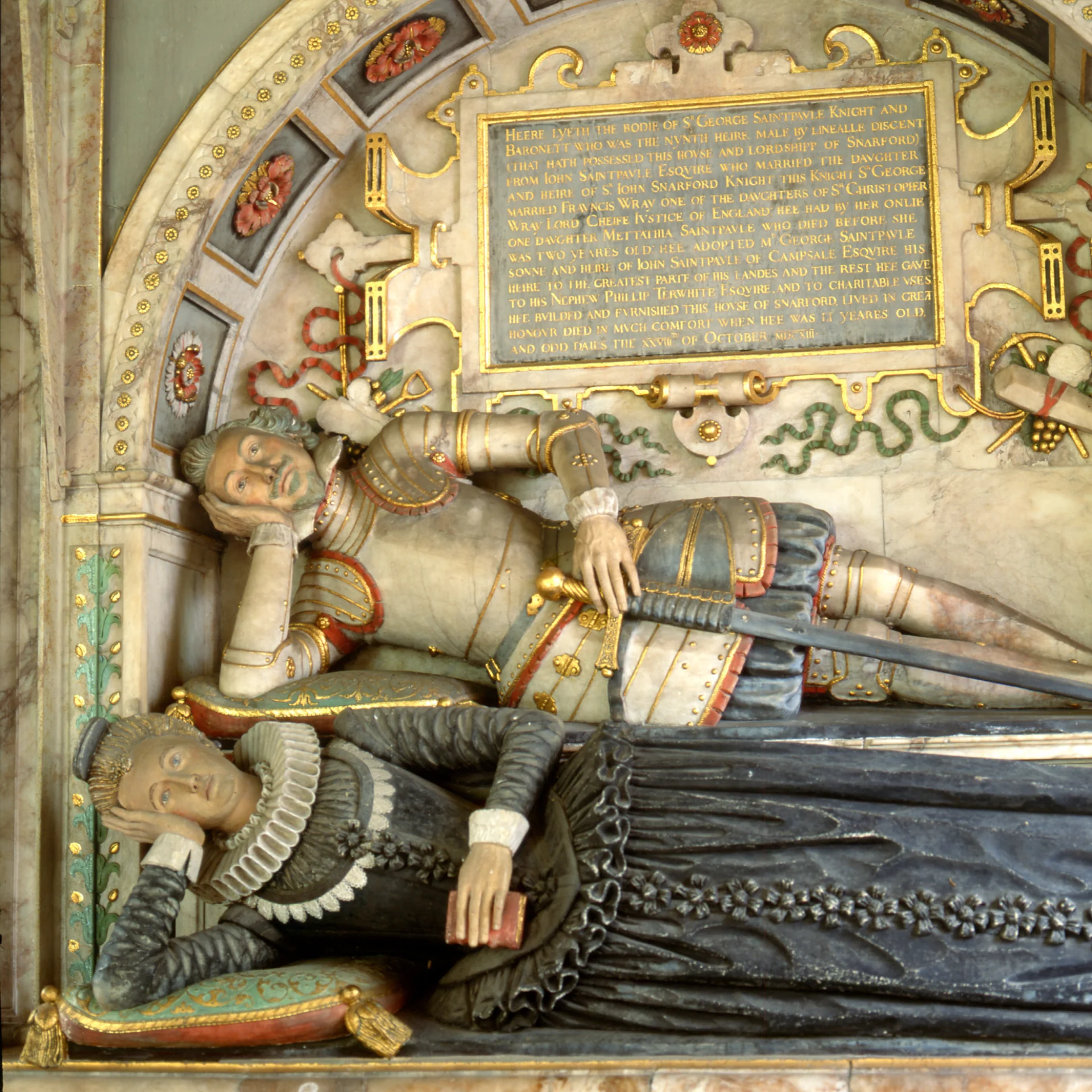 Effigies of Sir George and Lady Frances, both propped up on their elbows in a "toothache" pose in Jacobean dress.
