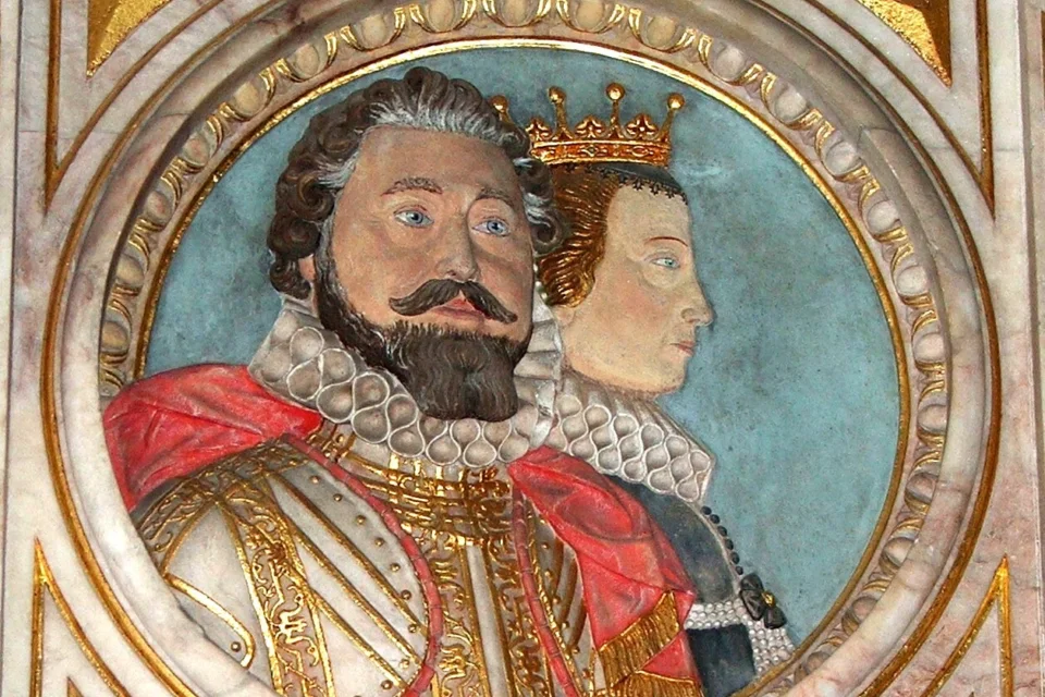 A colourful relief monument showing Frances Wray and her second husband Robert Rich, Earl of Warwick in Jacobean dress.