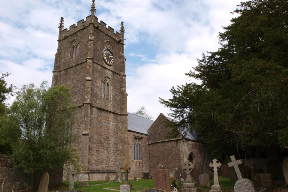 Norman church exterior with fifteenth century Pinnacled tower