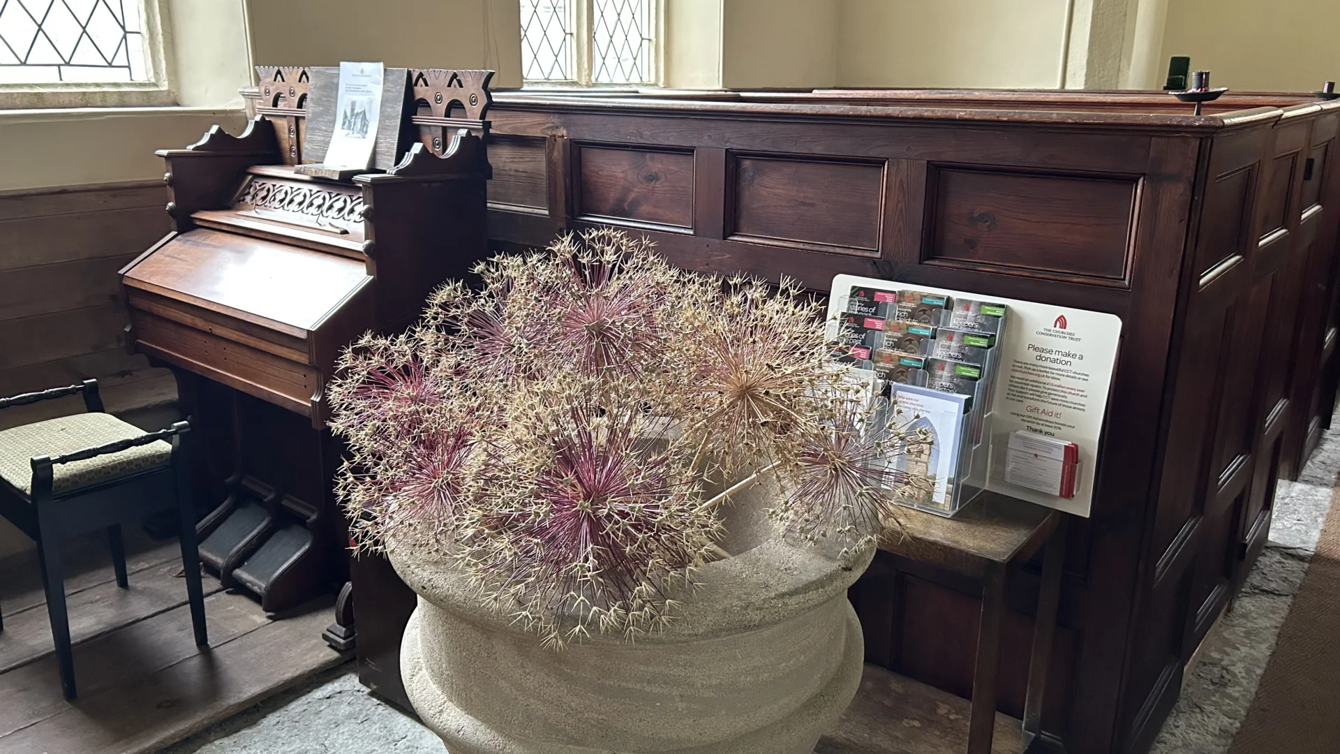 Sutton Mallet Church font containing dried flower decoration