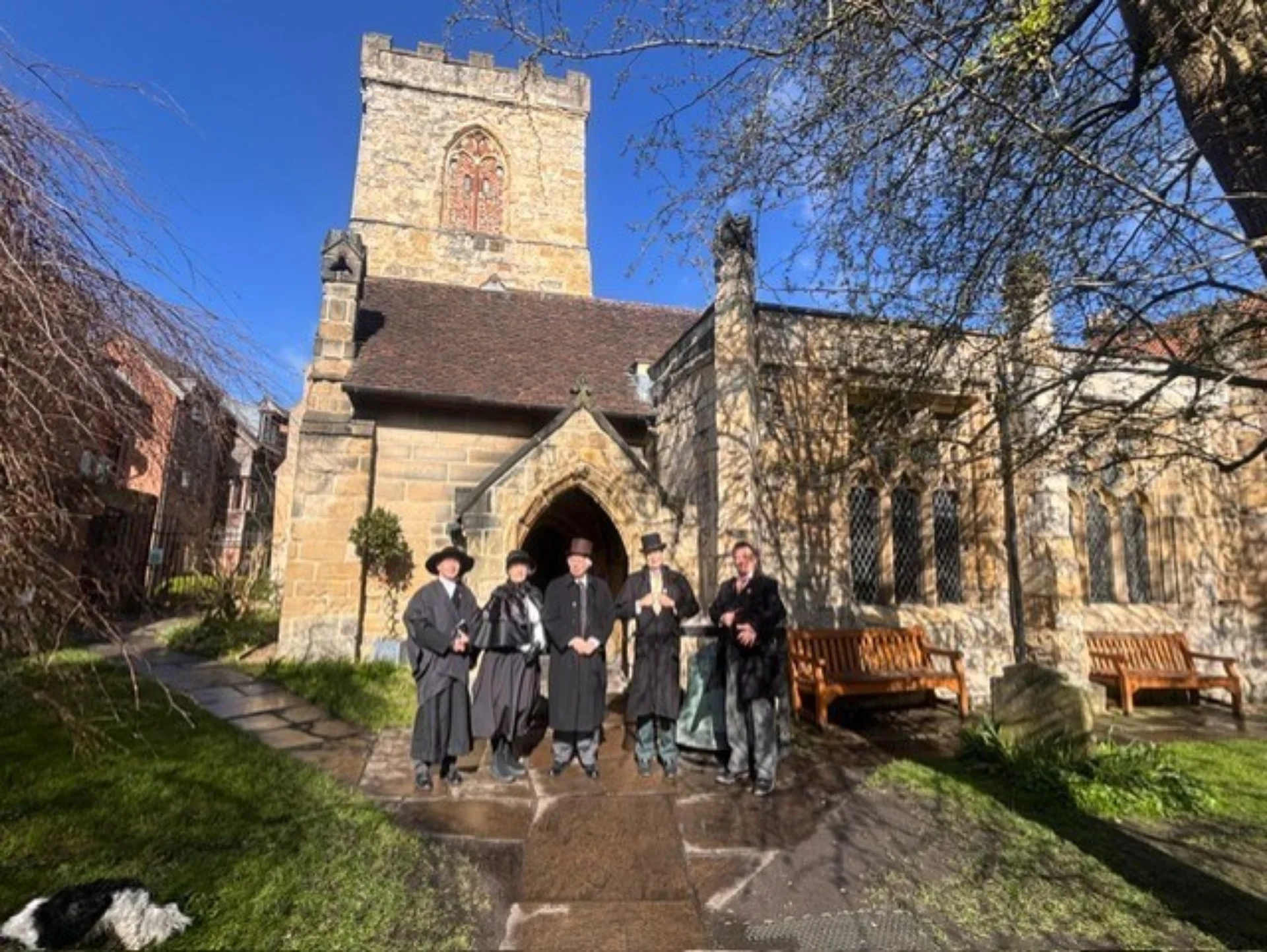 People in historic costumes posing outside Holy Trinity Goodramgate.