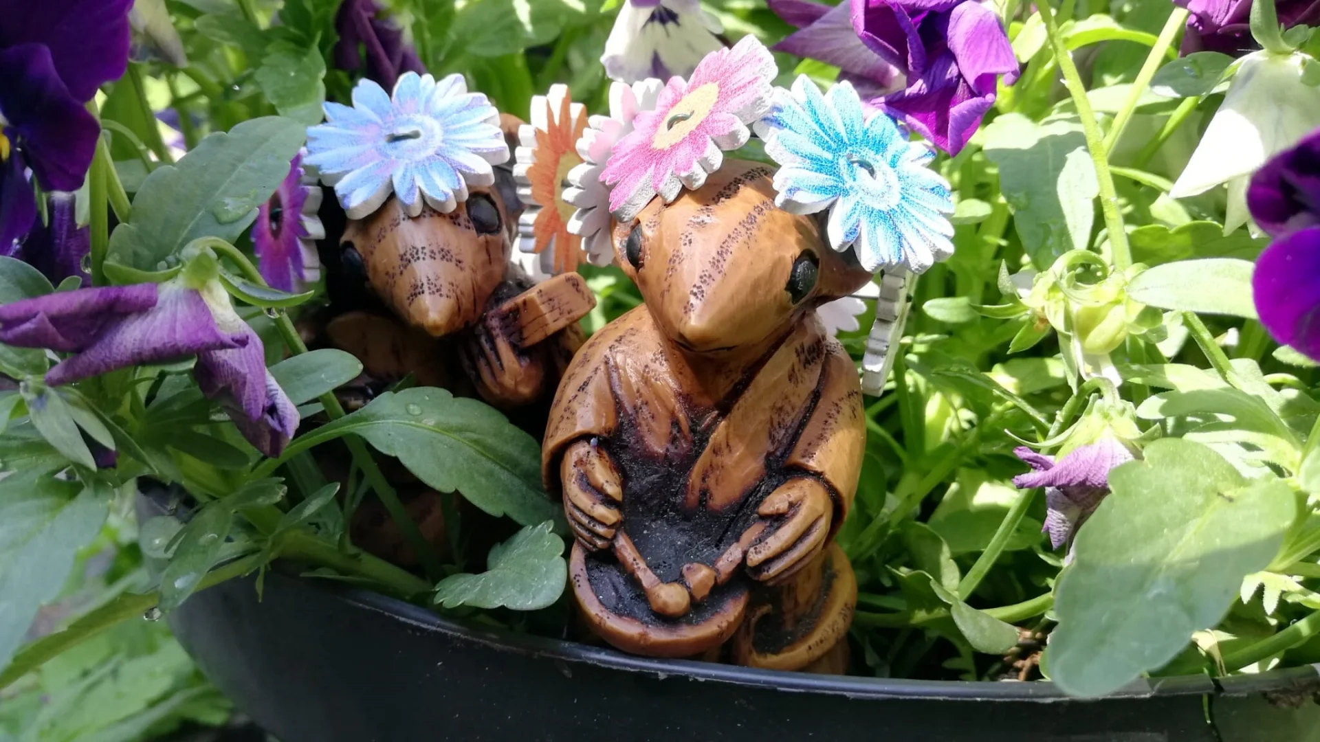 Wood effect mice set on grass wearing wooden flower crowns