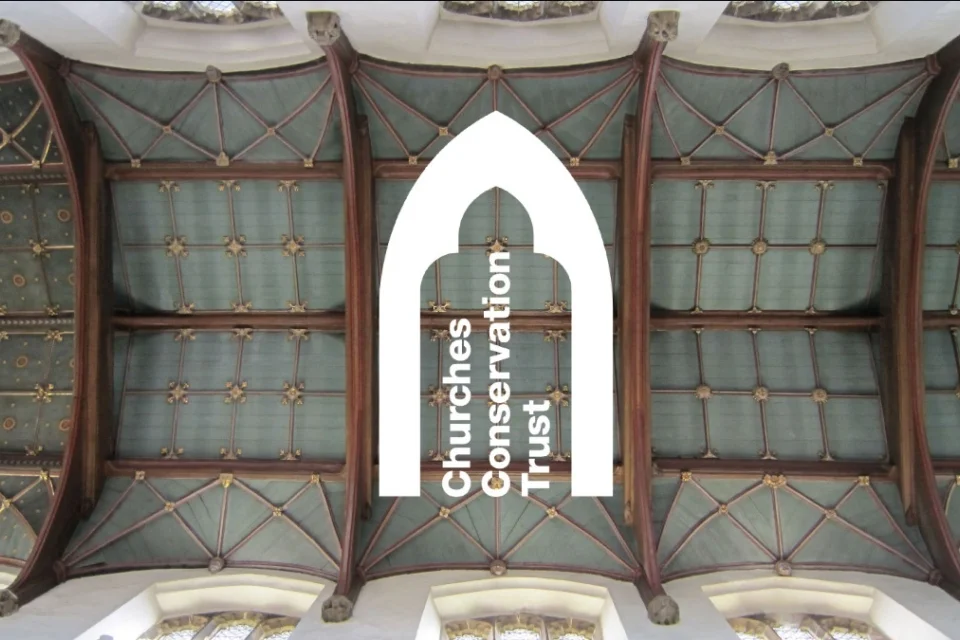 Painted ceiling of St Peter's Church in Sudbury, with CCT logo imposed over the top.