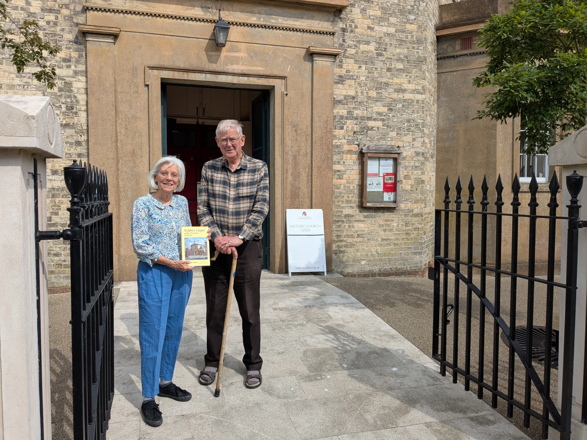 Victoria Simkin and Alan Green outside St. John's Chapel, Chichester