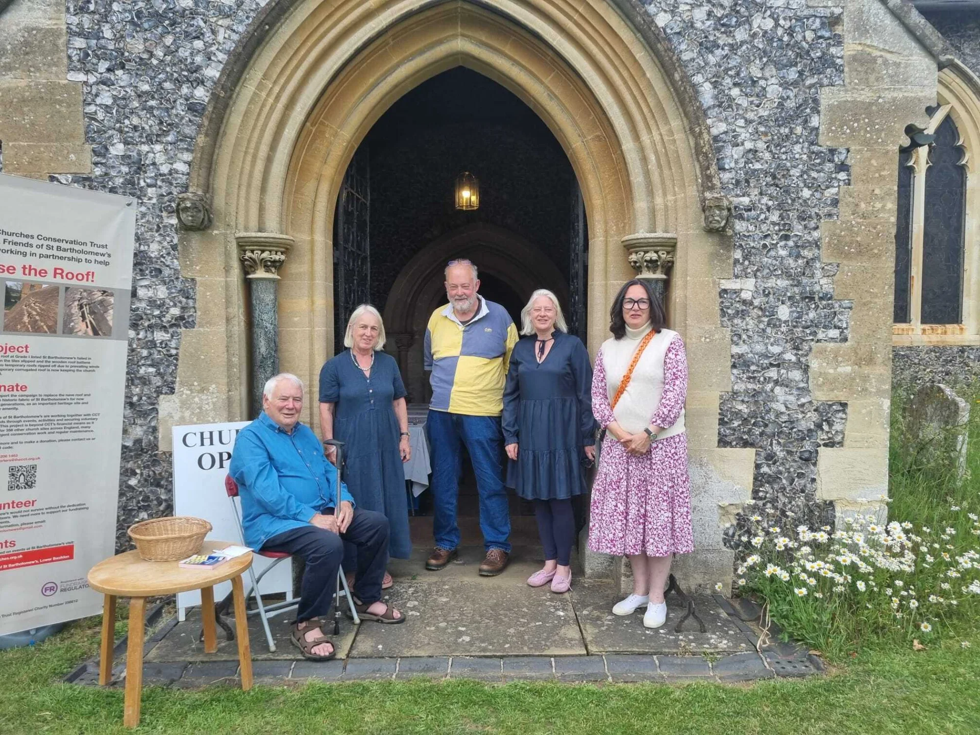 Members of the Lower Basildon Fundraising Board posing for a picture in the doorway of the church.