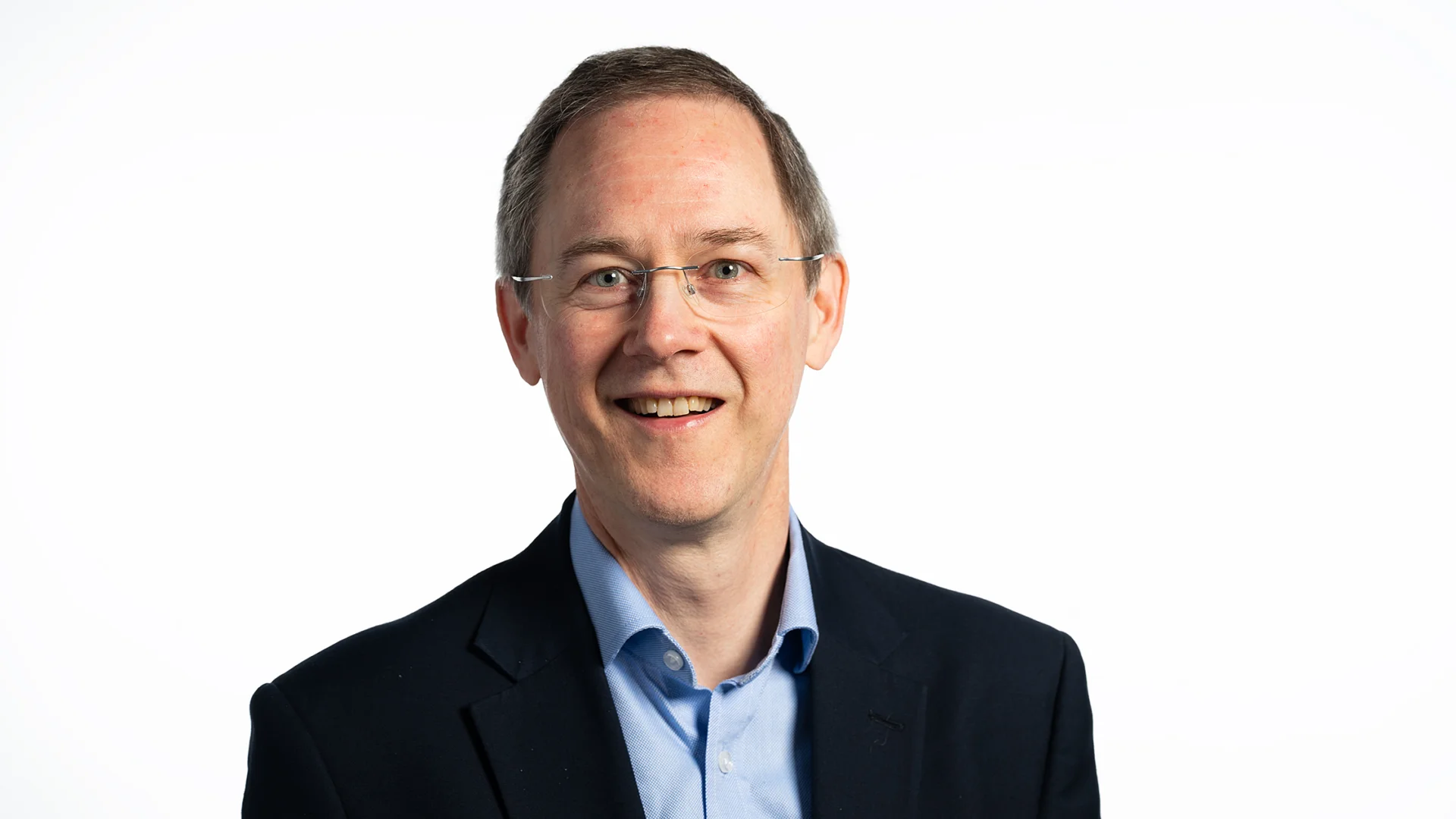 A man in a shirt and suit jacket