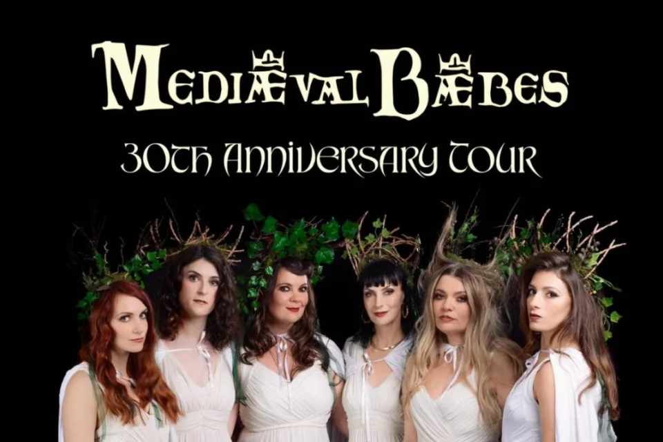 6 women grouped together in white dresses with woodland styled headpieces