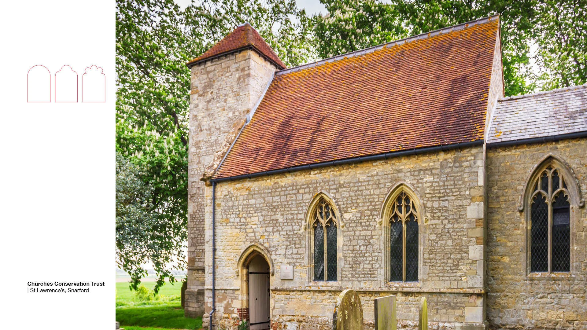 Small stone church with red slate roof