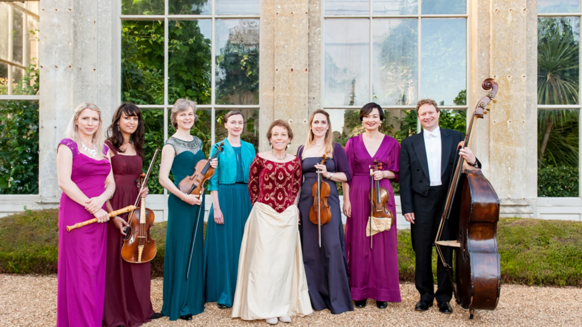 Classical musicians by an orangery