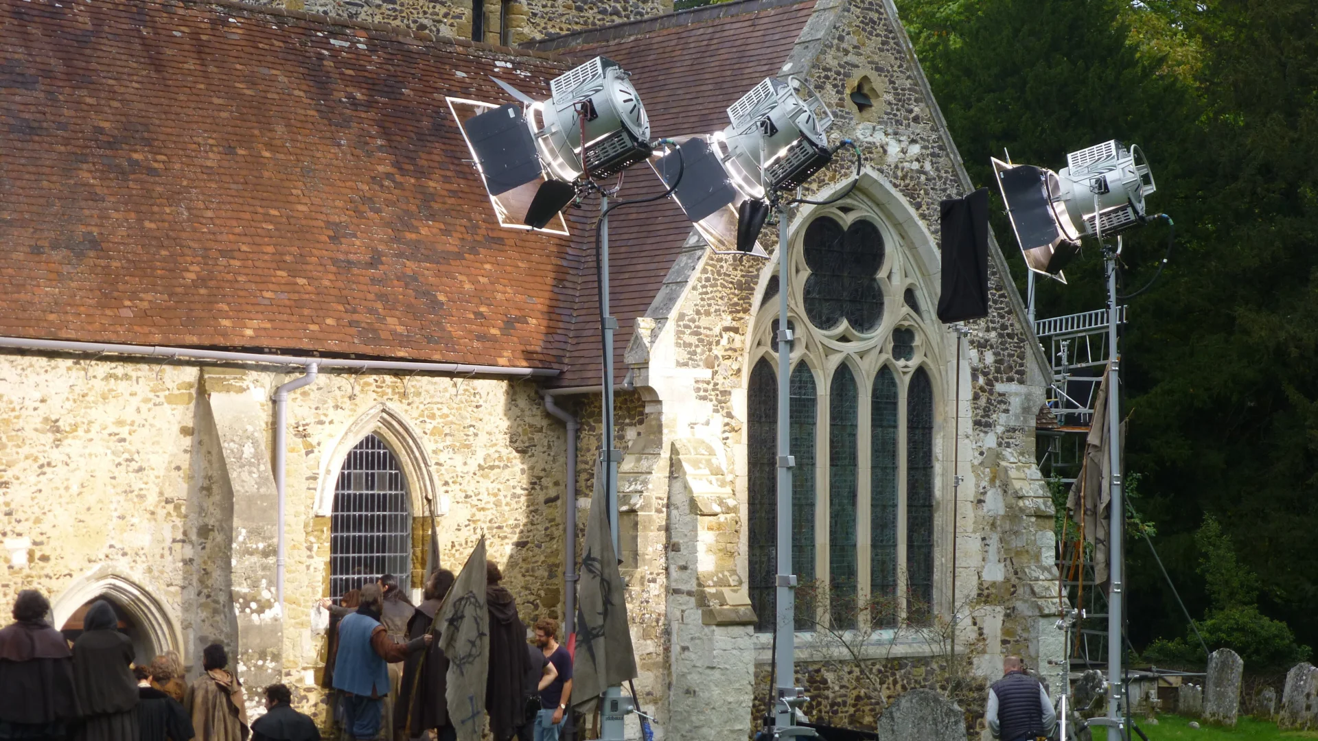 Filming crew working outside the church