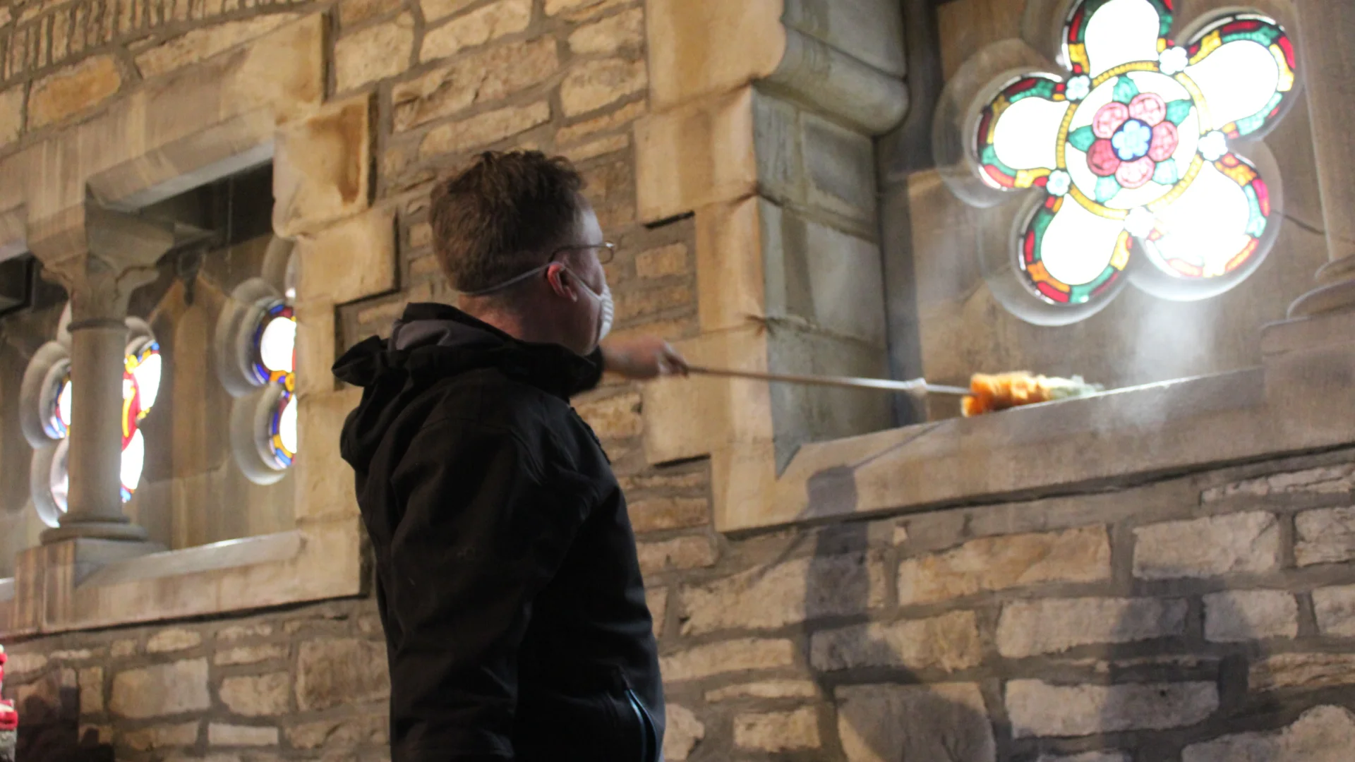 A volunteer helping to clean one of CCT's churches