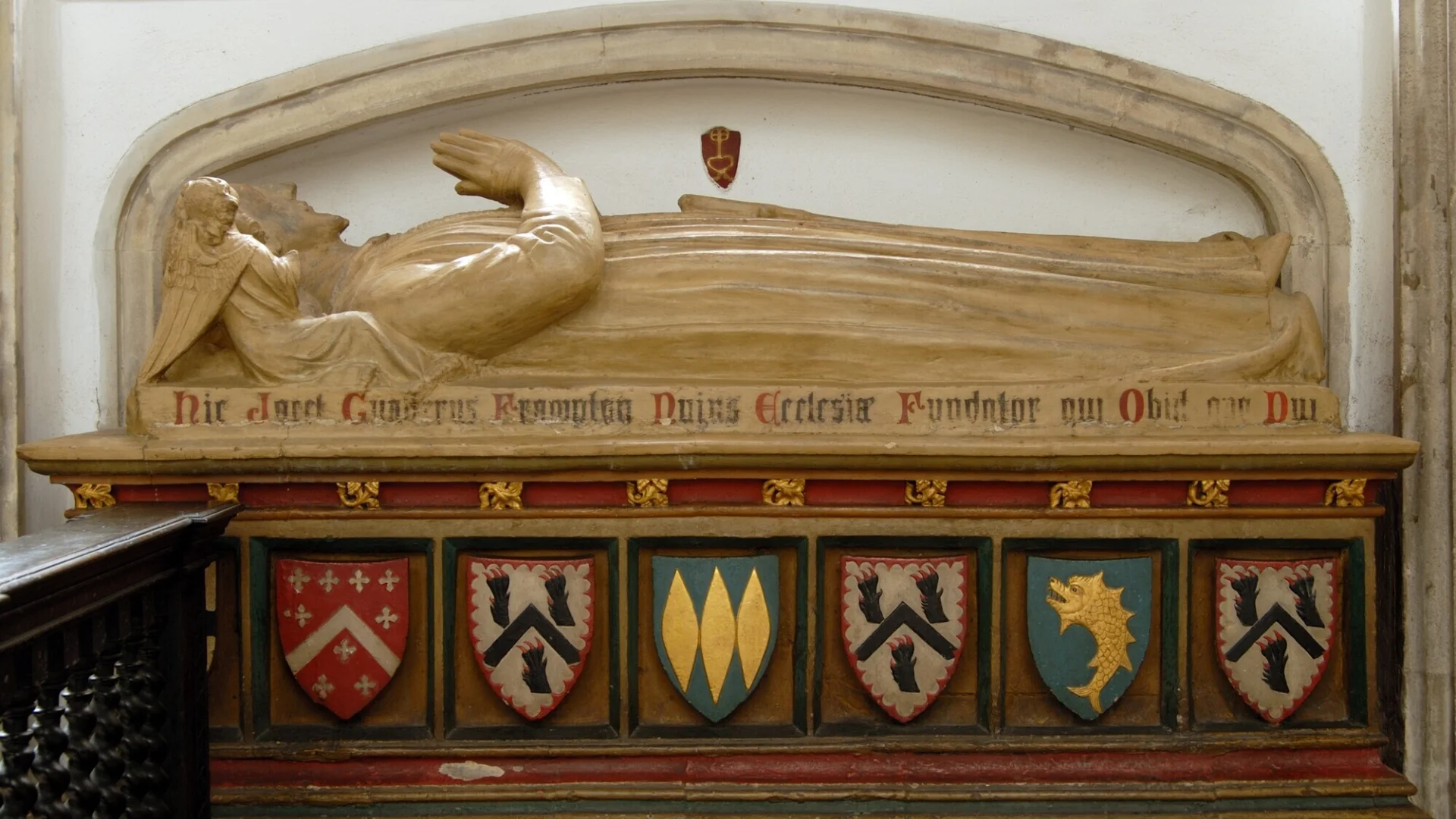 The stone carved tombchest with its effigy of Walter Frampton, who was mayor of the city three times and founded this church before his death in 1388. This splendid monument stands in the chancel, decorated with heraldic shield and with a long-tailed dog at Walter Frampton's feet.