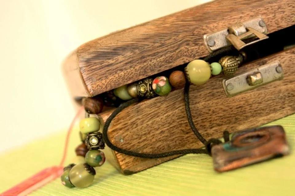 wooden jewellery box with jewellery shown