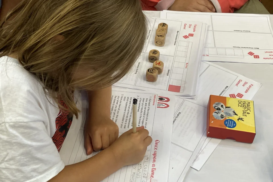A child completing a family activity at Blackshuck Festival 2025