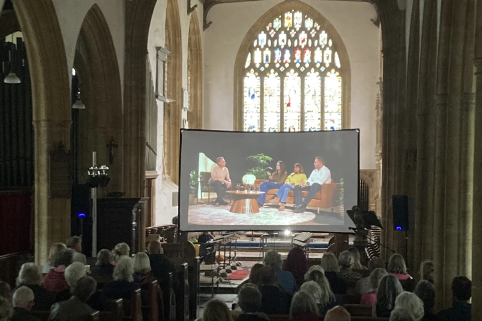 A crowd gathered in the pews of Langport to watch a screening of the People's Emergency Briefing