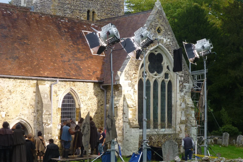 Filming crew working outside the church