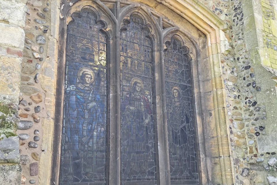 St Leonard-at-the-Hythe, Colchester window after works to apply a mesh covering to protect the stained glass.