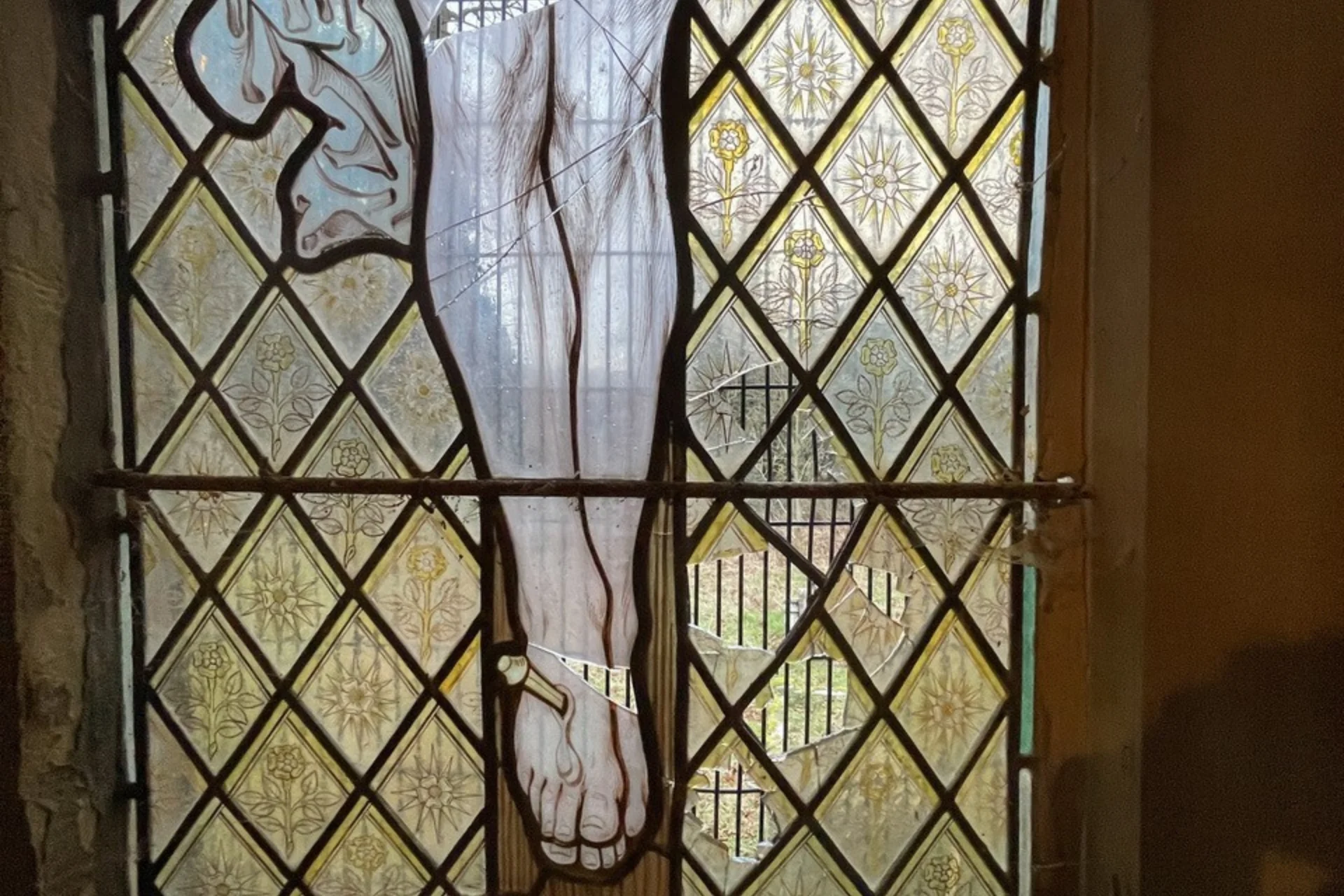 Vandalised window at St Michael and All Angels', Brownsover