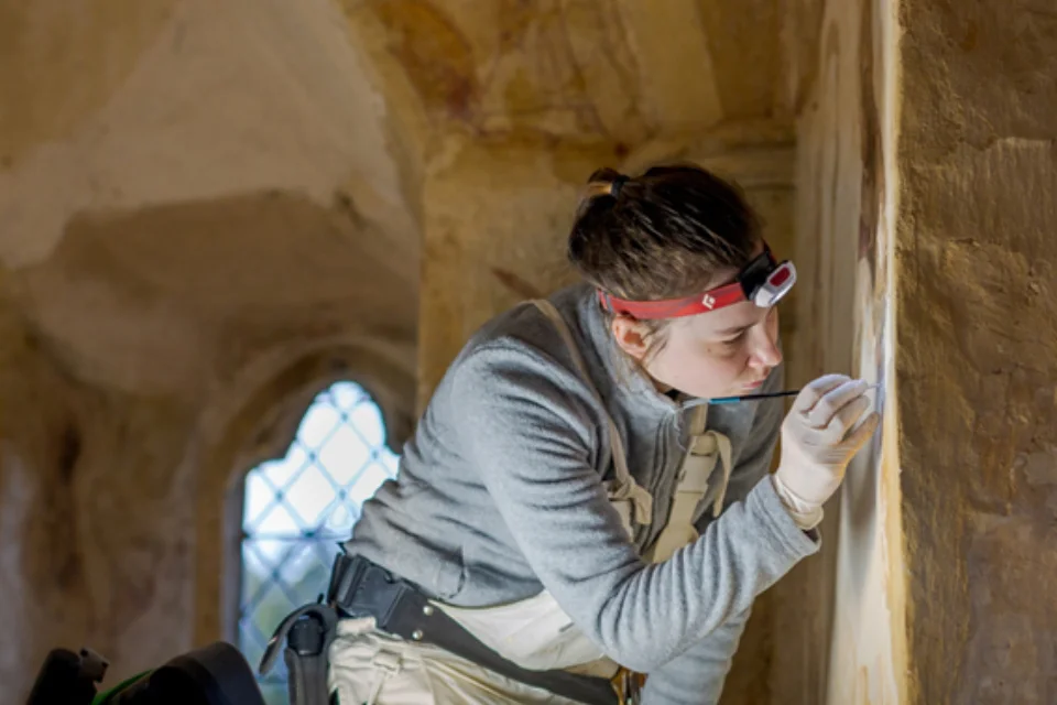 A Courtauld MA student conserving the important 13th-century wall paintings in Longthorpe Tower, Peterborough, which for